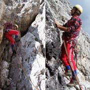 Alpinista durante una scalata su una parete rocciosa